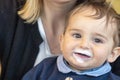 Baby boy with milk mustache making funny faces Royalty Free Stock Photo