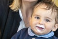 Baby boy with milk mustache making funny faces Royalty Free Stock Photo