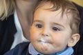 Baby boy with milk mustache making funny faces Royalty Free Stock Photo