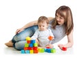 Baby boy and mom play with building blocks Royalty Free Stock Photo