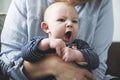 Baby boy on mother`s arms