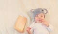 Baby boy in mouse hat lying on blanket with cheese Royalty Free Stock Photo