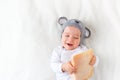 Baby boy in mouse hat lying on blanket with cheese Royalty Free Stock Photo