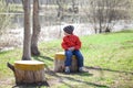 Baby boy in orange jaket and blue jeans Royalty Free Stock Photo