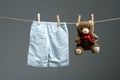 Baby boy pants, a teddy bear on the clothesline