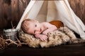 Baby boy, photo studio on a wooden background