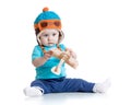 Baby boy pilot and with wooden airplane toy Royalty Free Stock Photo