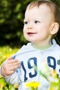 Baby boy play with dandelions Royalty Free Stock Photo