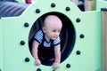 Baby Boy In A Playground Tunnel Royalty Free Stock Photo