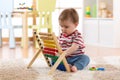 Baby boy playing with abacus Royalty Free Stock Photo