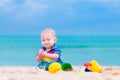 Baby boy playing on a beach Royalty Free Stock Photo