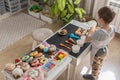 Baby boy playing cafe kitchen cashier payment counting use cash register counter early development Royalty Free Stock Photo