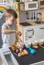 Baby boy playing cafe kitchen cashier payment counting use cash register counter early development Royalty Free Stock Photo