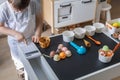 Baby boy playing cafe kitchen cashier payment counting use cash register counter early development Royalty Free Stock Photo