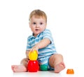 Baby boy playing with cup toys over white Royalty Free Stock Photo