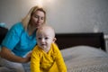 Baby boy playing with his mom, copy space Royalty Free Stock Photo