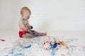 Baby boy playing with homemade fingerpaints Royalty Free Stock Photo