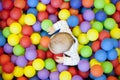 Baby boy playing in the playground balls pool Royalty Free Stock Photo