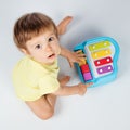 Baby boy playing toy piano Royalty Free Stock Photo