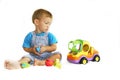 Baby boy playing with toy-truck Royalty Free Stock Photo