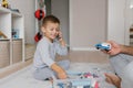 Baby boy playing with toys on the floor in the nursery Royalty Free Stock Photo