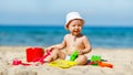 Baby boy playing with toys and sand on beach Royalty Free Stock Photo