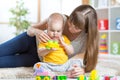 Baby boy playing toys together mother Royalty Free Stock Photo