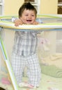 Baby boy in playpen