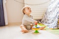 Baby boy plays in his room. Royalty Free Stock Photo