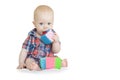 Baby boy plays with multi-colored soft cubes