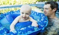 Baby Boy Plays in a Pool in Mexico with his Father Royalty Free Stock Photo