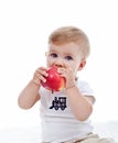 Baby boy with red apple