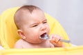 Baby boy refusing to eat food and crying Royalty Free Stock Photo