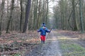 Baby boy running through the forest Royalty Free Stock Photo