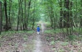 Baby boy running through the forest Royalty Free Stock Photo