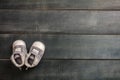 Baby boy shoes on blue wooden background Royalty Free Stock Photo