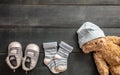 Baby boy shoes and socks on blue wooden background Royalty Free Stock Photo