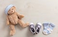 Baby boy shoes and socks on wooden background Royalty Free Stock Photo