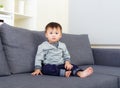 Baby boy sit on sofa Royalty Free Stock Photo