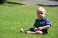 Baby boy sitting on the grass Royalty Free Stock Photo