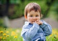 Baby boy sitting on the grass in field Royalty Free Stock Photo