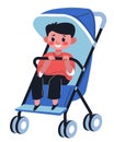 Baby boy sitting in perambulator holding handle