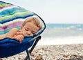 Baby boy sleeping on the beach Royalty Free Stock Photo