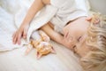 Baby boy sleeping with kitten. Child and cat Royalty Free Stock Photo