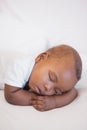 Baby boy sleeping peacefully on couch Royalty Free Stock Photo