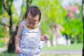 Baby Boy Sneezing while Walking in the Park, Child having Allergy and Itchy nose, Kid has Reflection or Hay Fever from Dust Mite, Royalty Free Stock Photo