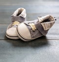 Baby boy blue shoes on blue color background, closeup view Royalty Free Stock Photo