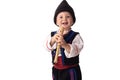 Baby boy in traditional Bulgarian folklore costumes. Happy kid posing with flute, wooden whistle