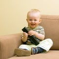 Baby boy with TV remote