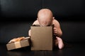 Baby boy unpacking surprise box